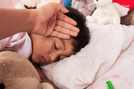 Child with a fever sleeping